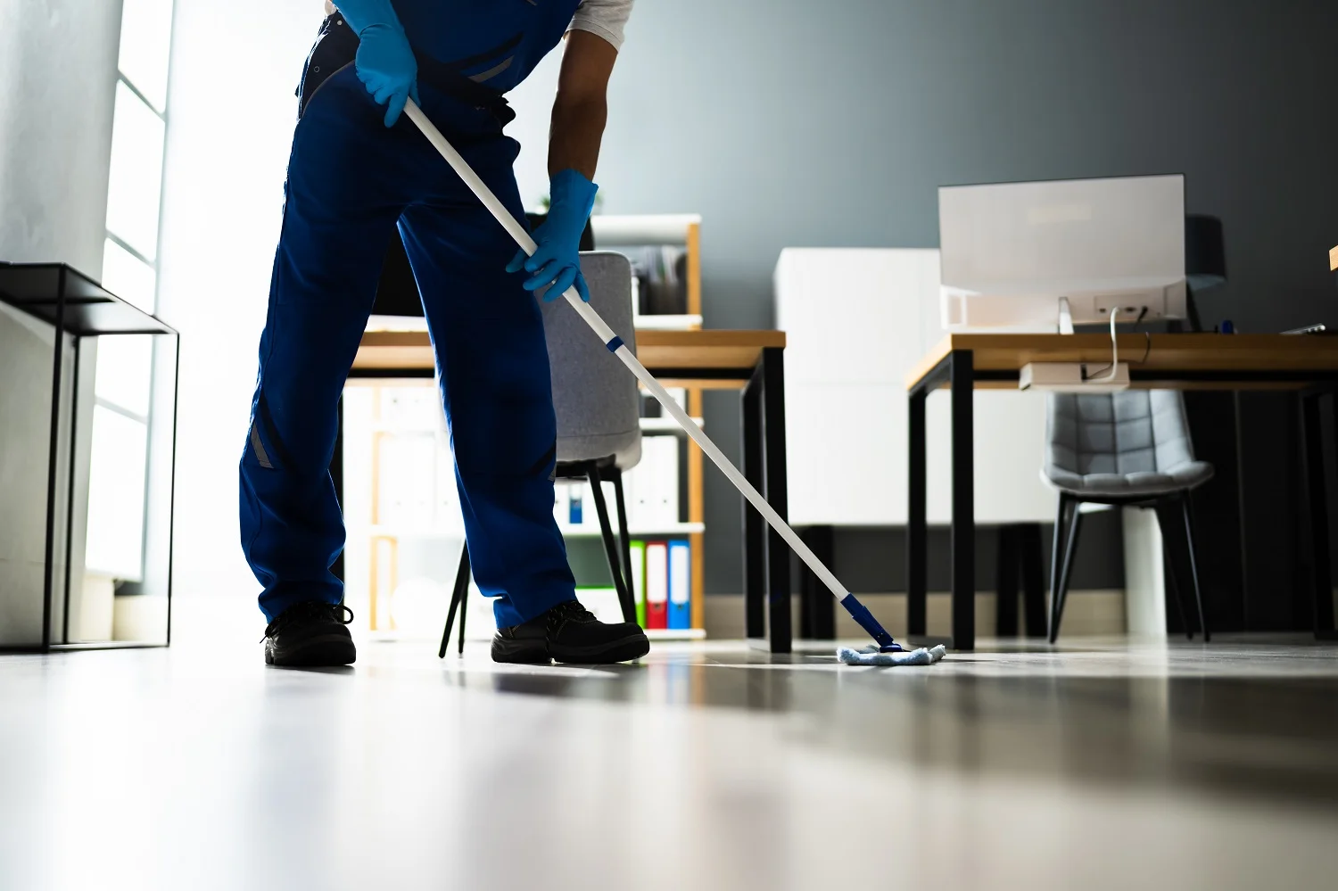 a cleaner mopping the floor for end of tenancy cleaning Paddington W2